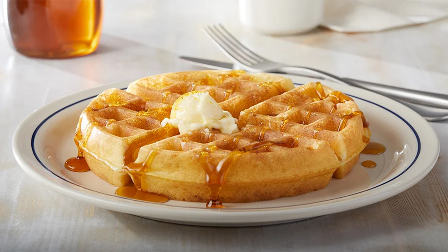 Golden Belgian waffle with whipped butter