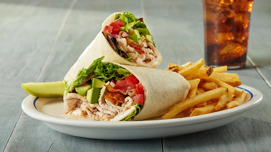Turkey and vegetable wrap with fries