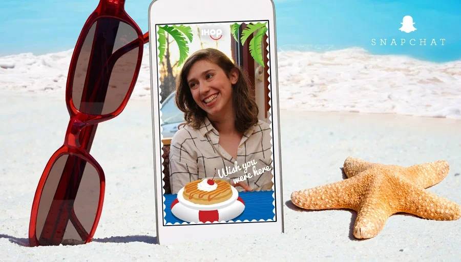 Snapchat filter postcard selfie on the sand with sunglasses and a starfish